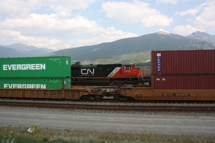 Westbound CN loco passing eastbound freight